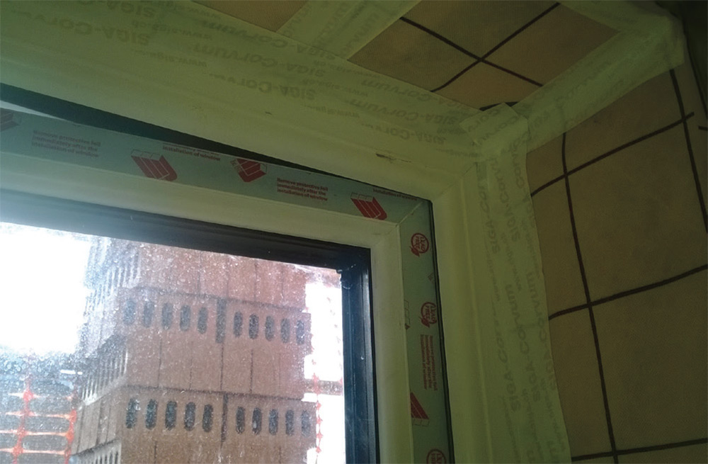 Airtightness taping over joints, while insulated window and door reveals reduce thermal bridging