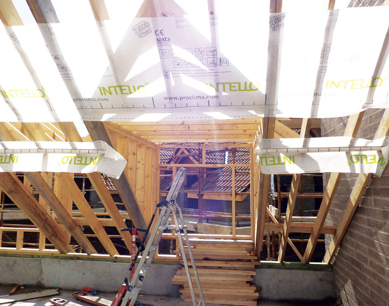 The airtight membrane was applied in sections, so that its continuity wasn’t disrupted by collar ties Certified Passive 12