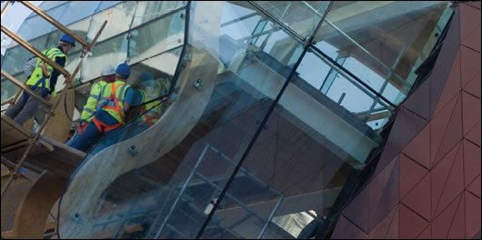 Child's Play View of the children's museum's front and side elevations showing its unique structural glazing, both attractive to the eye and relatively energy efficien