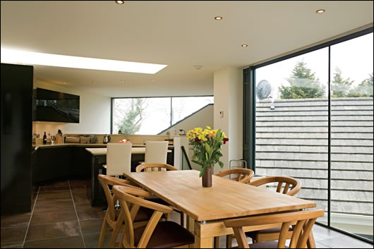 The the first floor contains the kitchen and dining area and was designed to maximise natural lighting and space The the first floor contains the kitchen and dining area and was designed to maximise natural lighting and space