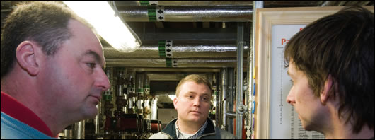 Mechanical services engineer Paul Lynch and Frank Daly of Kinviro discussing the heating system with John Hearne Mechanical services engineer Paul Lynch and Frank Daly of Kinviro discussing the heating system with John Hearne