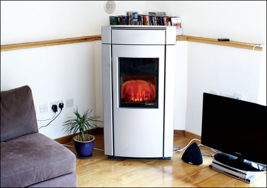 A Palazzetti biomass stove is the focus of the living room A Palazzetti biomass stove is the focus of the living room