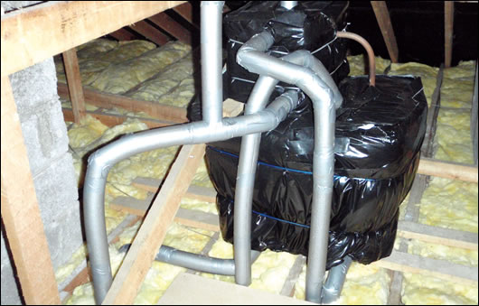 With the insulation reducing heat loss into attics, water tanks and pipes were insulated and neatly sealed to prevent freezing With the insulation reducing heat loss into attics, water tanks and pipes were insulated and neatly sealed to prevent freezing