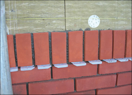(below and above) Ibstock’s Brickshield system, with Rockwool high density external insulation coated in the company’s adhesive mortar, before Ibstock brick slips are applied (below and above) Ibstock’s Brickshield system, with Rockwool high density external insulation coated in the company’s adhesive mortar, before Ibstock brick slips are applied