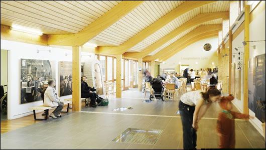 Internal view of the long hall showing the natural ventilation derived roof section and the clarity of the timber structure Internal view of the long hall showing the natural ventilation derived roof section and the clarity of the timber structure