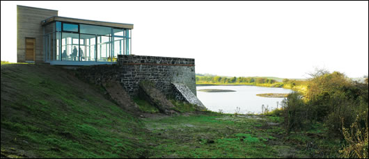 Tthe lime kiln pavilion perched above the renovated stone kiln with timber clad service pod to the rear Tthe lime kiln pavilion perched above the renovated stone kiln with timber clad service pod to the rear